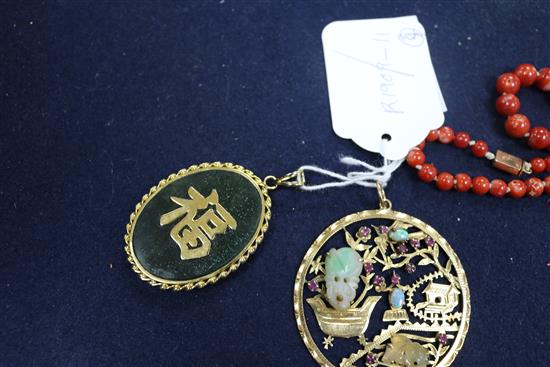 A Chinese 18ct gold and multi gem set pierced circular pendant, one other pendant and two items of coral.